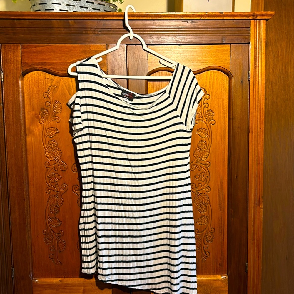 Black and cream striped asymmetrical tunic. One exposed shoulder
